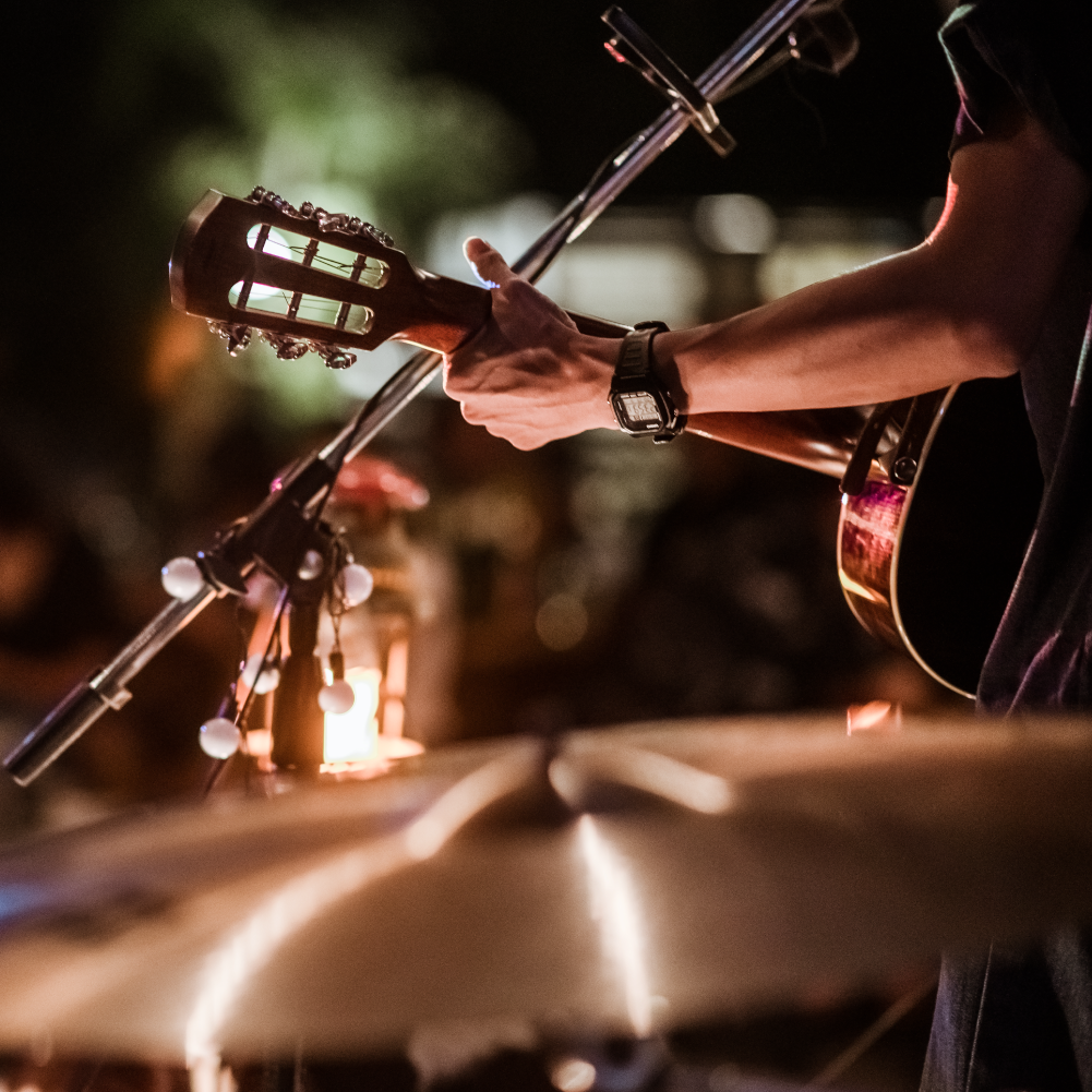 picture of a drummer perspective of a man playing guitar